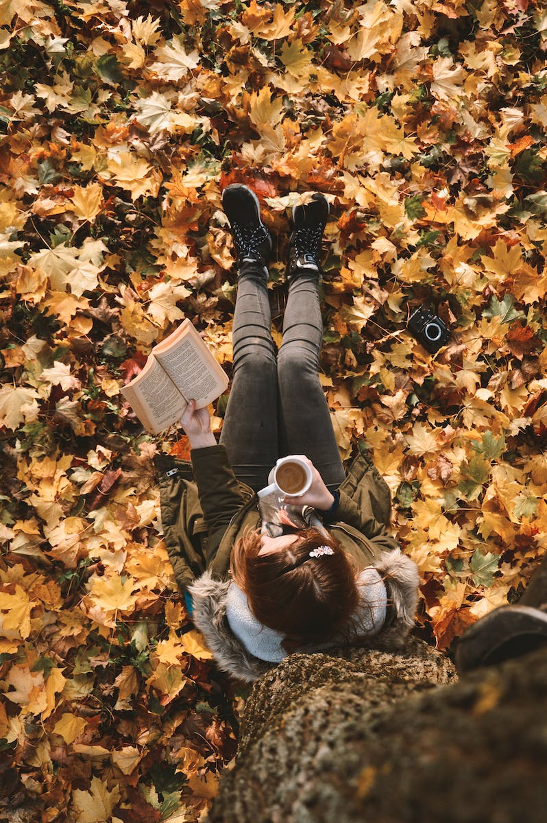 Woman Reading Book Under the Tree