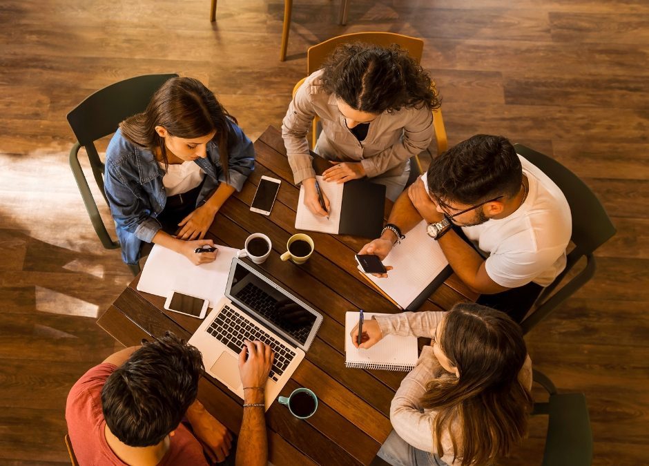 Writers talking and sharing ideas in a welcoming environment, symbolizing what it’s like to find a writing community.